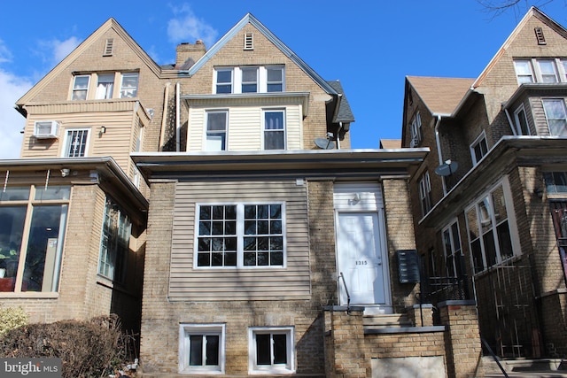 back of property with brick siding