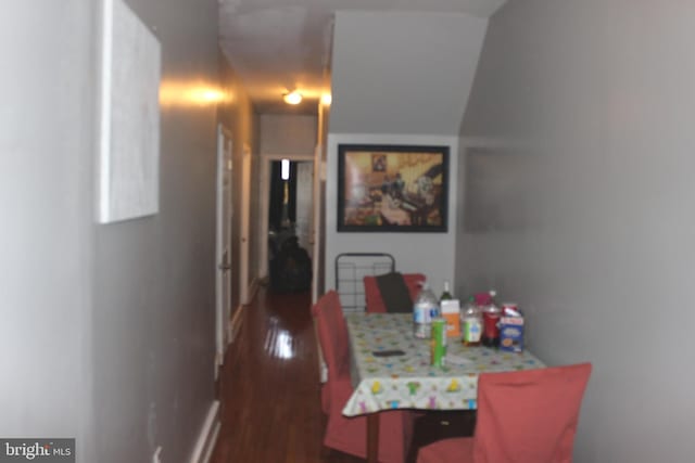 dining area featuring dark wood-style floors