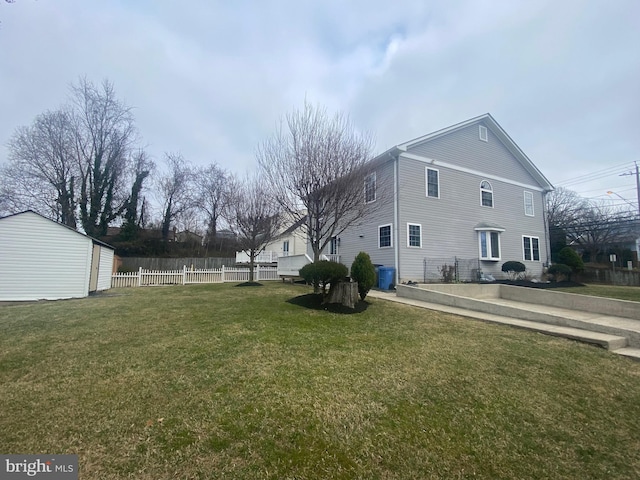 view of home's exterior featuring a yard and fence