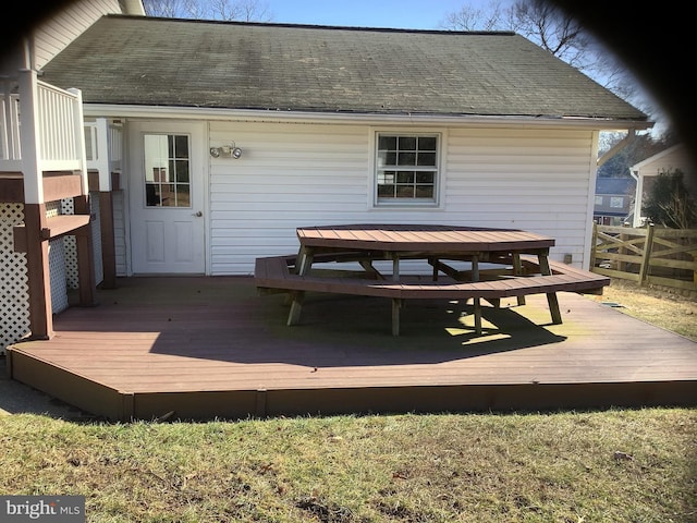 deck with outdoor dining space and fence