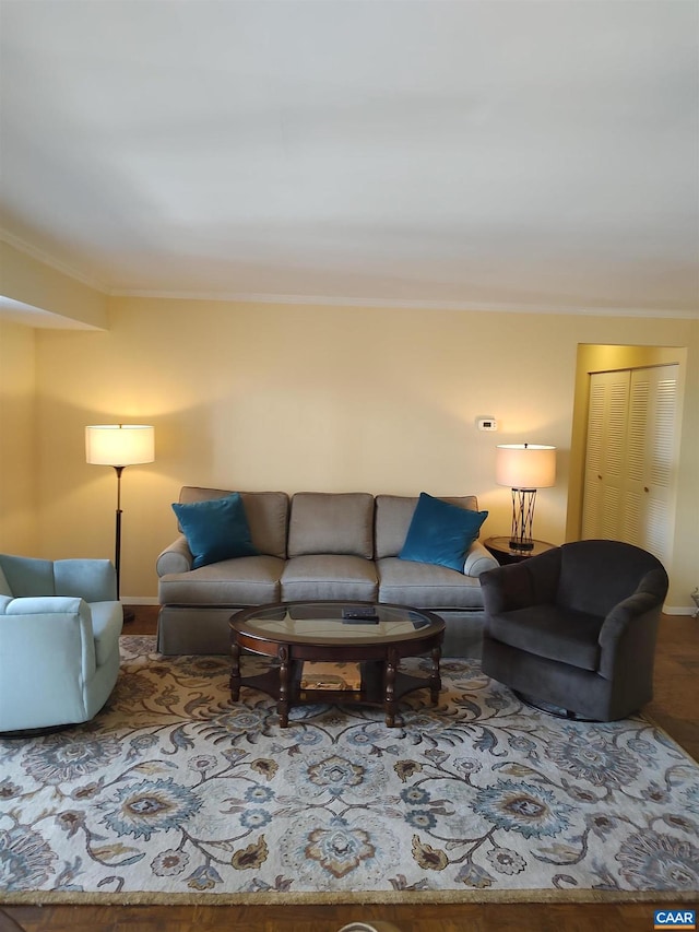 living room featuring crown molding and wood finished floors