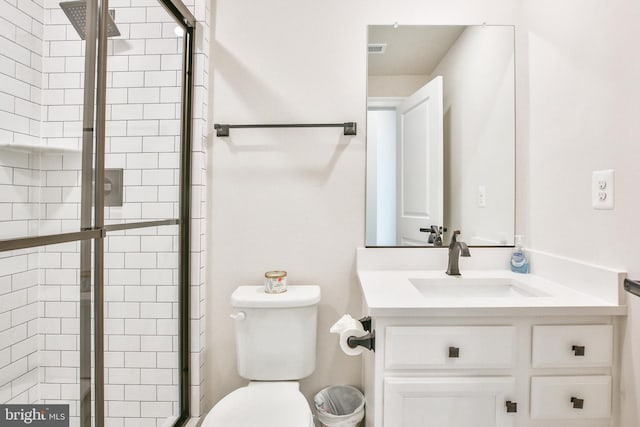 full bathroom with visible vents, toilet, a stall shower, and vanity