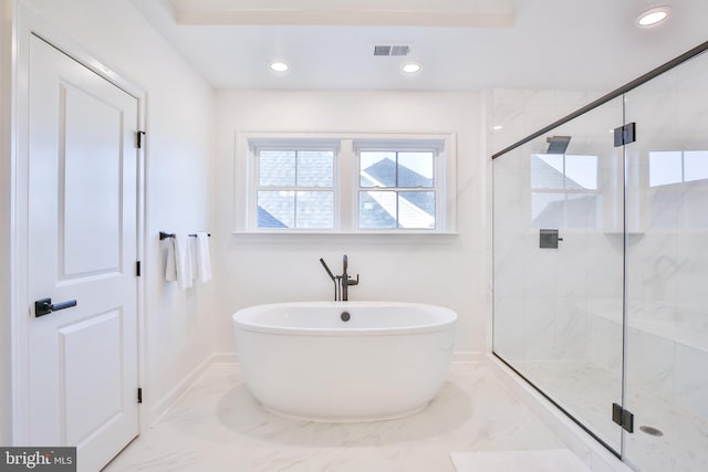 full bathroom featuring baseboards, a freestanding tub, recessed lighting, a shower stall, and marble finish floor