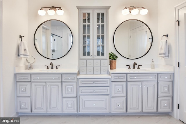 full bath with double vanity and a sink