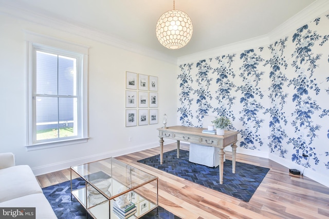 office area featuring baseboards, wood finished floors, ornamental molding, and wallpapered walls