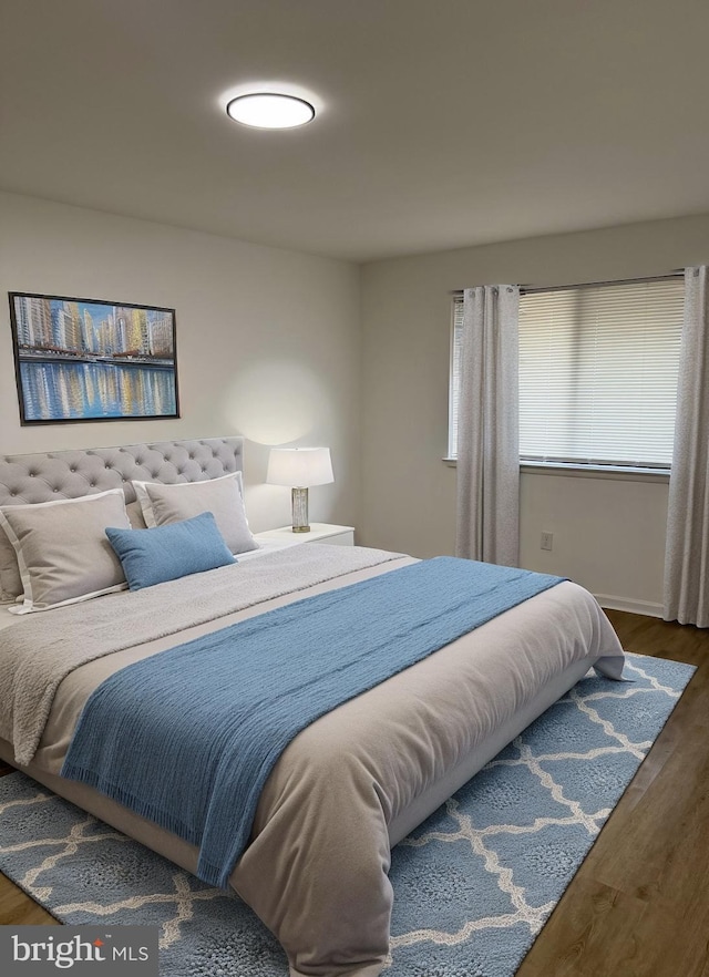 bedroom with wood finished floors