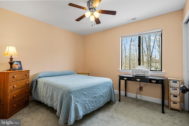 bedroom featuring baseboards, visible vents, carpet floors, and ceiling fan