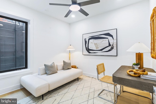 interior space with recessed lighting, ceiling fan, baseboards, and wood finished floors