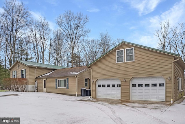 view of home's exterior with an attached garage