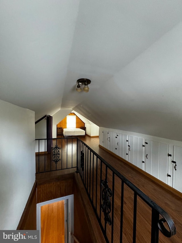 stairway featuring lofted ceiling