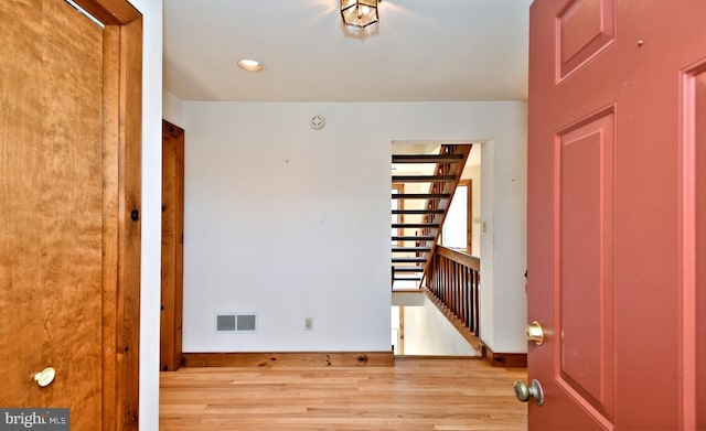 interior space with recessed lighting, visible vents, baseboards, and wood finished floors