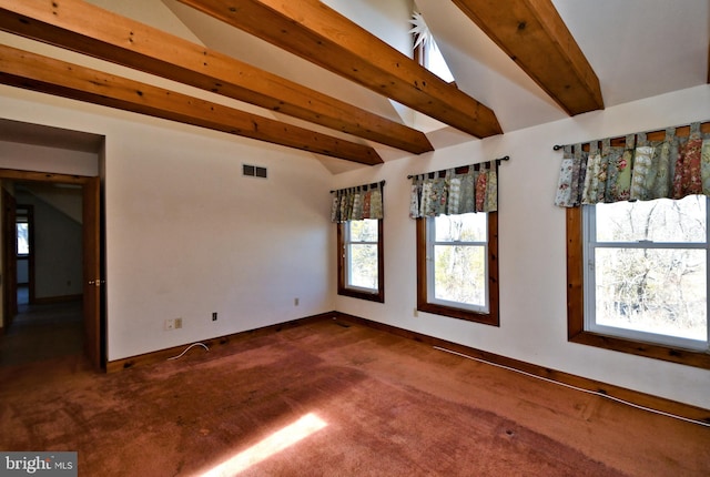 empty room with lofted ceiling with beams, visible vents, baseboards, and carpet flooring