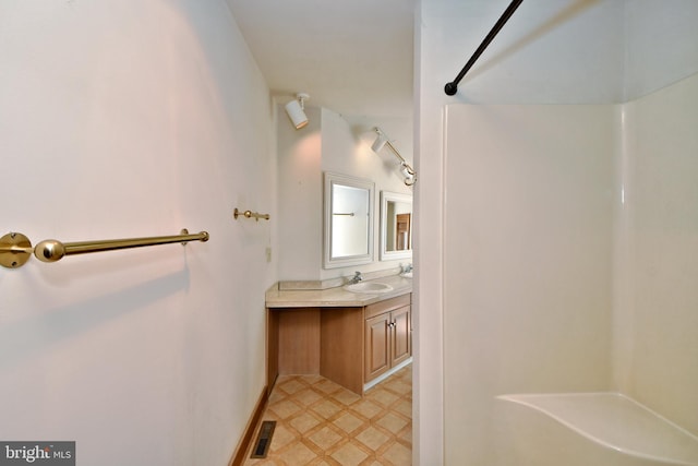 full bathroom featuring tile patterned floors, visible vents, vanity, and a shower