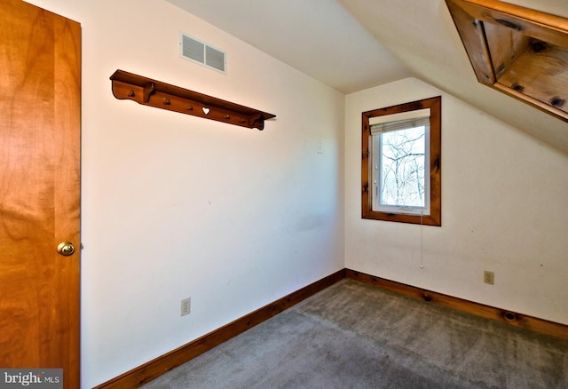 bonus room featuring baseboards, visible vents, carpet floors, and lofted ceiling