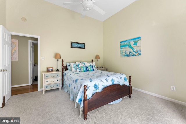 carpeted bedroom featuring a ceiling fan, baseboards, and high vaulted ceiling