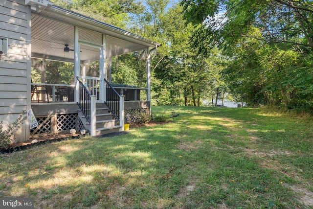 view of yard featuring a sunroom