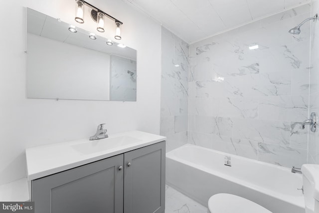 full bath with shower / washtub combination, marble finish floor, toilet, and vanity