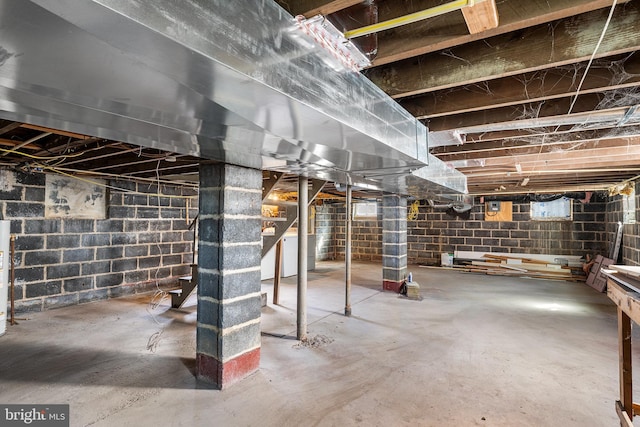 unfinished basement with stairs