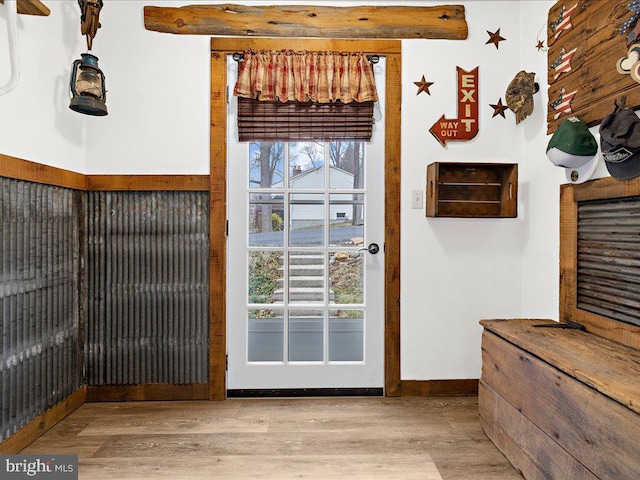 entryway with wood finished floors and baseboards