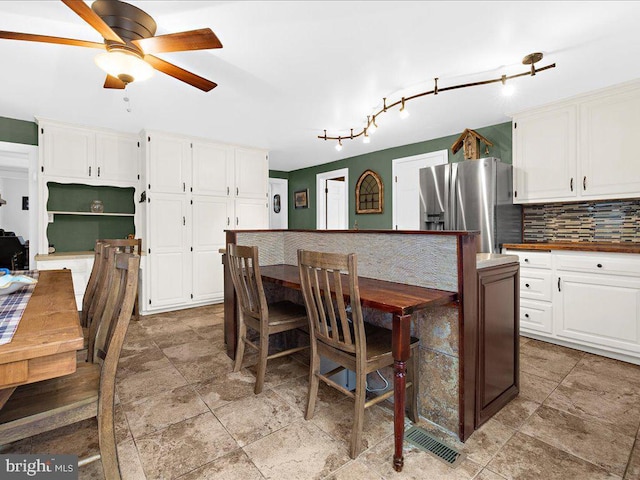 dining area with ceiling fan