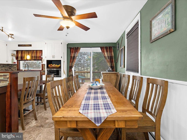 dining space featuring ceiling fan