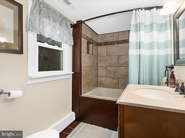 full bath featuring visible vents, shower / tub combo with curtain, toilet, baseboard heating, and vanity