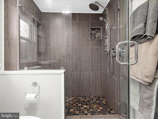 full bath with a shower stall