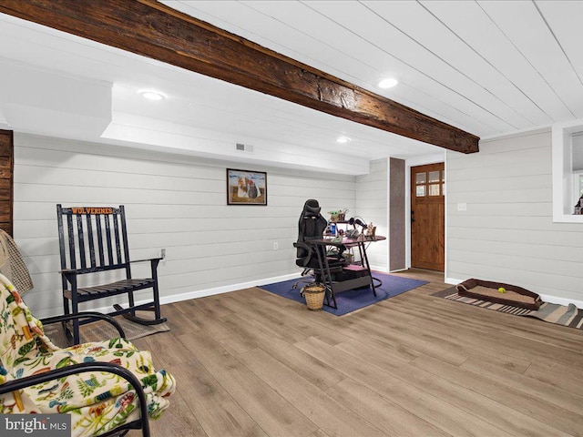 exercise room with visible vents, recessed lighting, wood finished floors, and baseboards