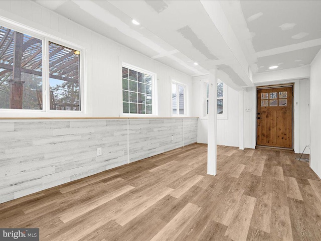 below grade area featuring recessed lighting and wood finished floors