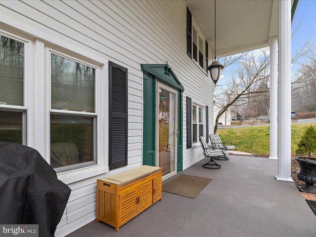 view of patio / terrace featuring area for grilling and a porch