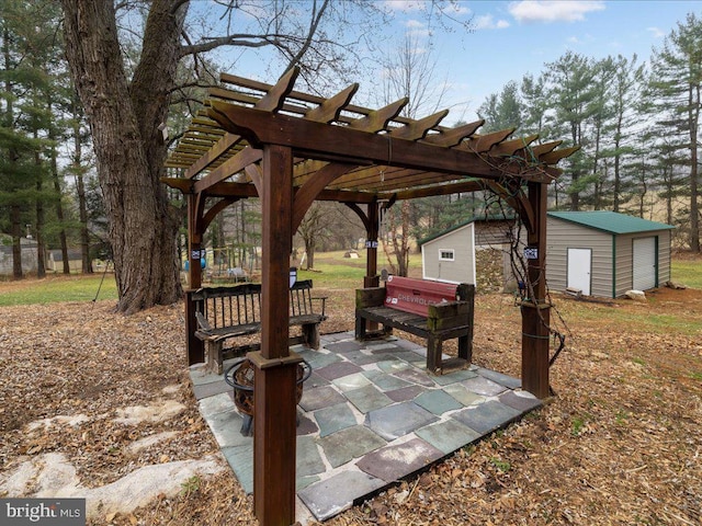 view of patio / terrace featuring a shed, a pergola, and an outdoor structure