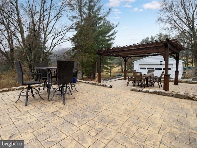 view of patio / terrace featuring a pergola and outdoor dining area