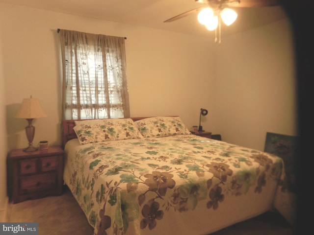 bedroom featuring a ceiling fan and carpet