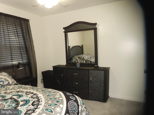 bedroom featuring a ceiling fan, baseboards, and carpet floors