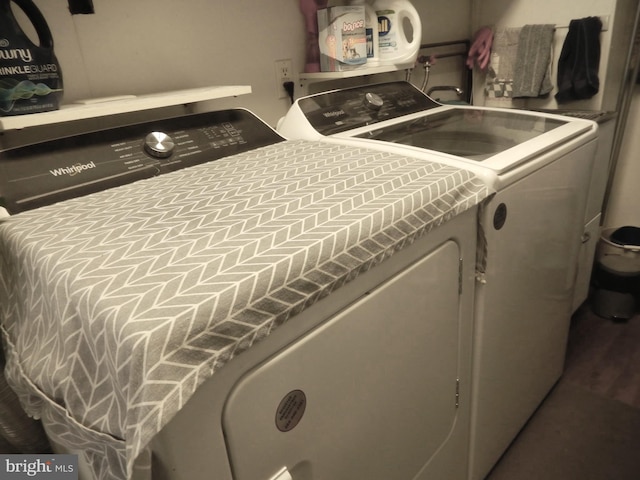 laundry room featuring washer and clothes dryer and laundry area