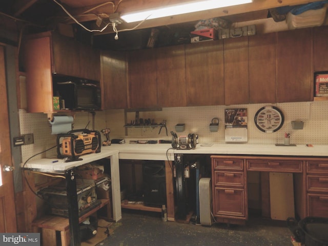kitchen featuring backsplash and light countertops