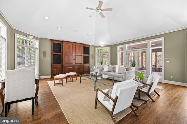 living room with wood finished floors, a healthy amount of sunlight, crown molding, and ceiling fan