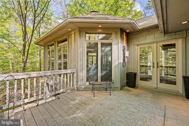 wooden deck featuring french doors