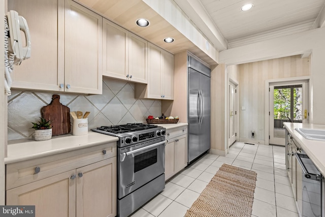 kitchen with stainless steel appliances, light countertops, recessed lighting, and backsplash