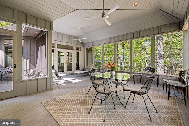 sunroom featuring ceiling fan, french doors, and outdoor dining space