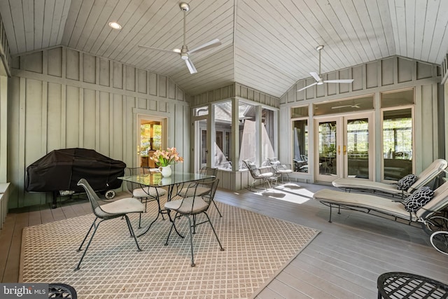 sunroom with a ceiling fan and french doors