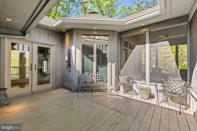 exterior space with french doors and a sunroom