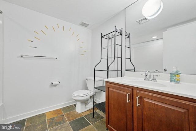 bathroom featuring stone tile flooring, visible vents, toilet, and vanity