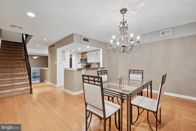 dining room featuring visible vents and stairs