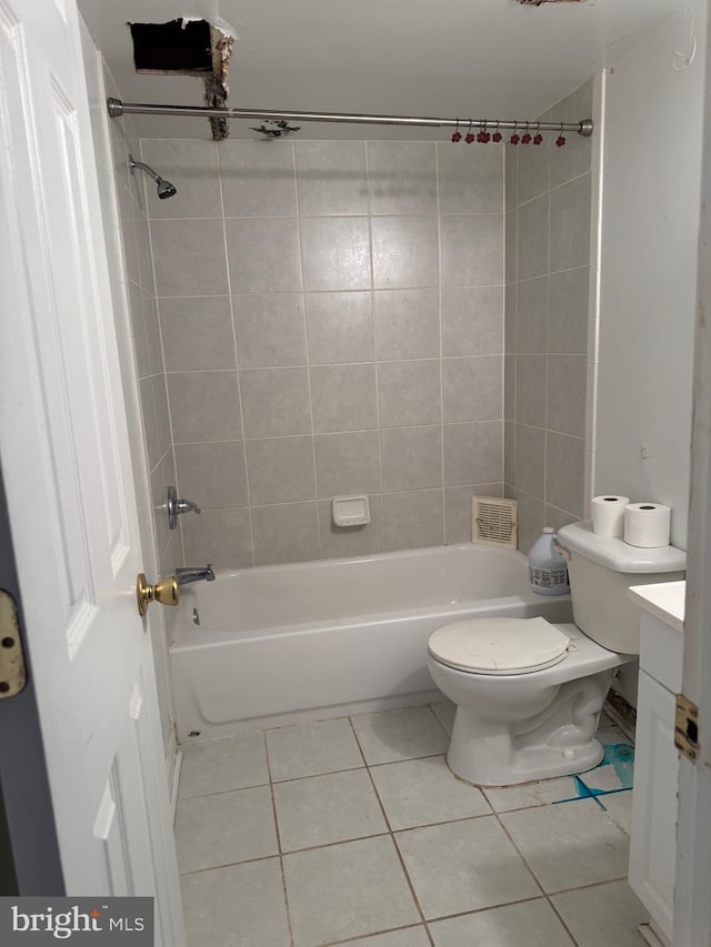 bathroom featuring vanity, shower / bathing tub combination, toilet, and tile patterned floors