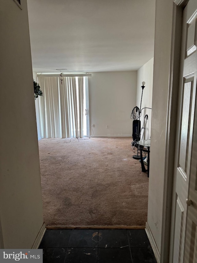 hallway with dark carpet