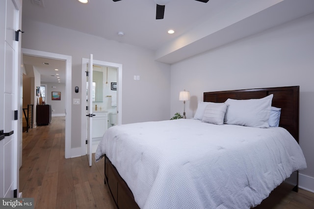 bedroom featuring hardwood / wood-style floors, a ceiling fan, baseboards, ensuite bath, and recessed lighting