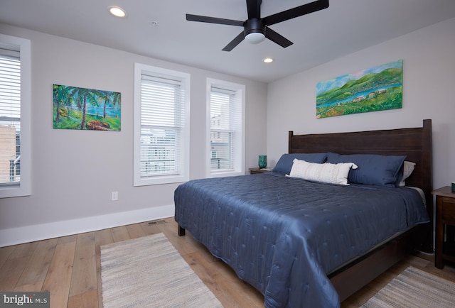 bedroom featuring recessed lighting, light wood-type flooring, and baseboards