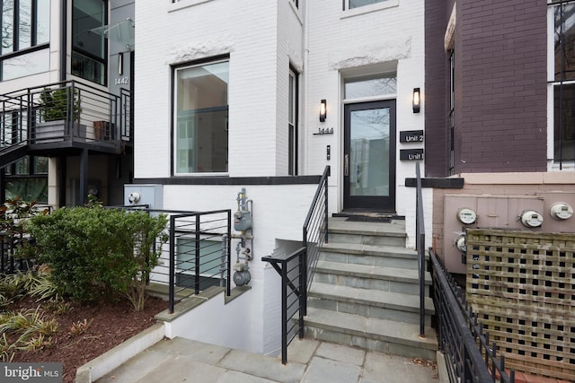 property entrance with brick siding