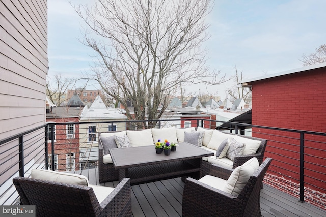 wooden terrace with a residential view and an outdoor hangout area